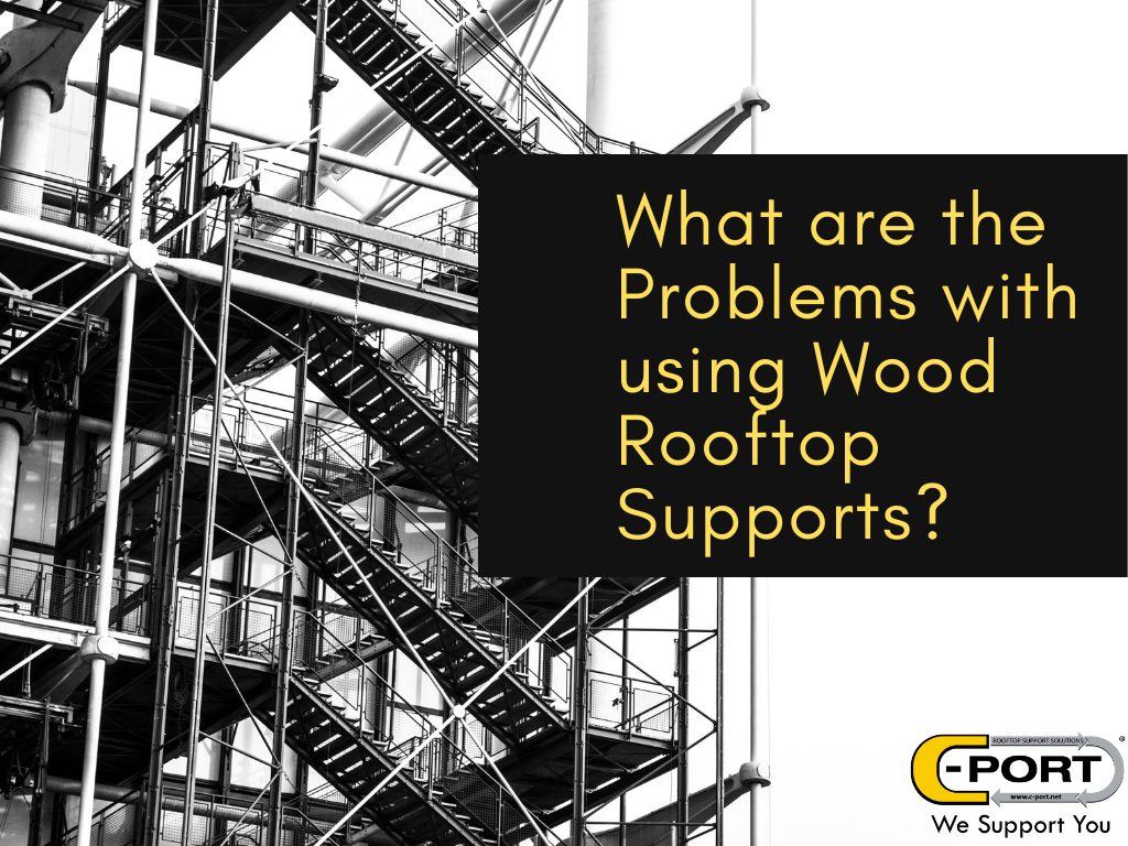 What are the problems with using wood rooftop pipe supports?